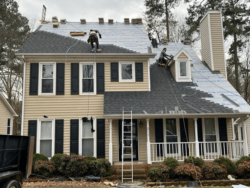 image of a roof being replaced with shingles exposed